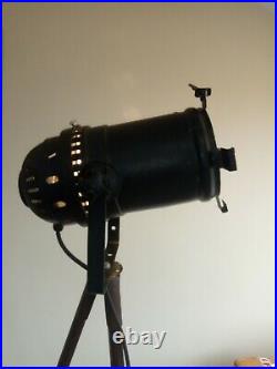 Vintage theatre spotlight mounted on ww1 tripod stand fully working